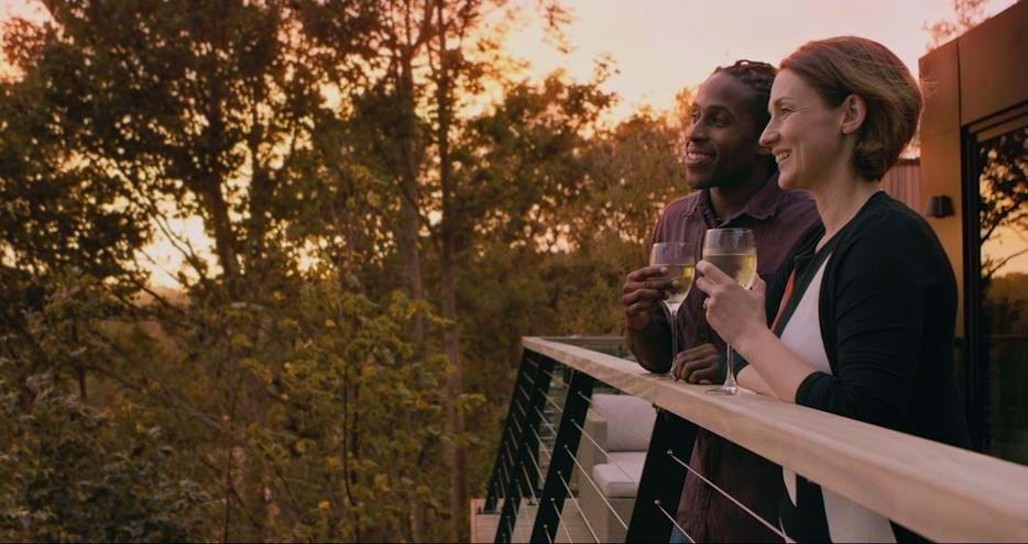 Drinks on the balcony at sunset at Treehouse Hotel at Port Lympne Hotel and Reserve in Kent