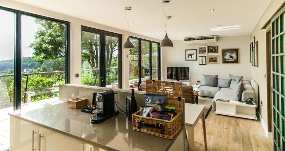 Modern, spacious living area in your Treehouse Hotel suite at Port Lympne Reserve in Kent