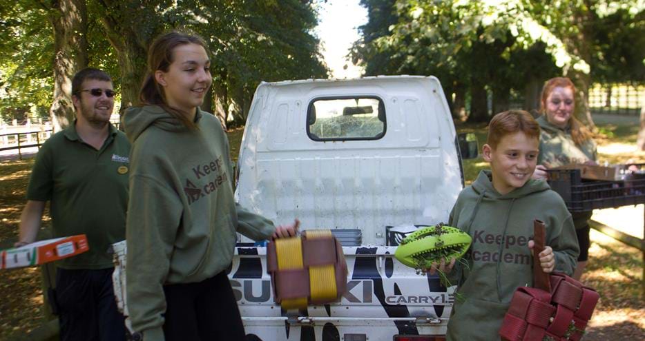Keeper Academy students taking enrichment items to the primates at Howletts Wild Animal Park in Kent