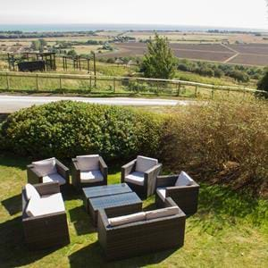 Enjoy drinks in the garden at Giraffe Cottage, Port Lympne Hotel & Reserve in Kent