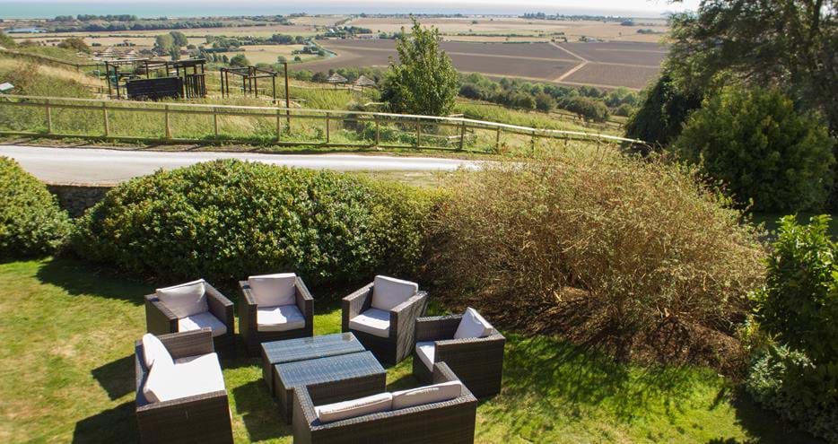 Enjoy drinks in the garden at Giraffe Cottage, Port Lympne Hotel & Reserve in Kent