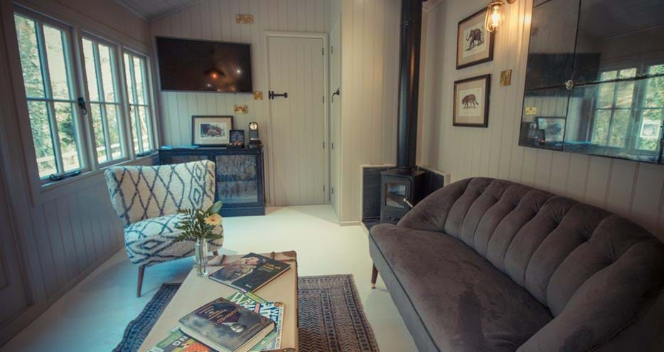 Living area of Hog Deer Creek shepherds hut at Port Lympne Reserve in Kent