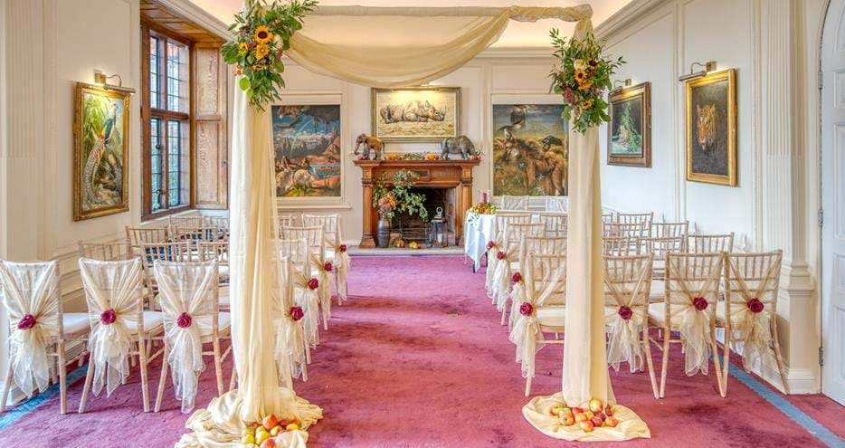 Wedding ceremony setup in The Long Room at Port Lympne Hotel in Kent
