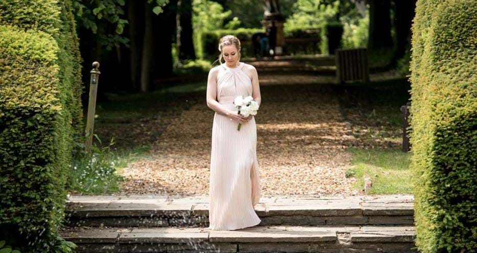 Bride arrives for the ceremony at Port Lympne Hotel wedding venue in Kent