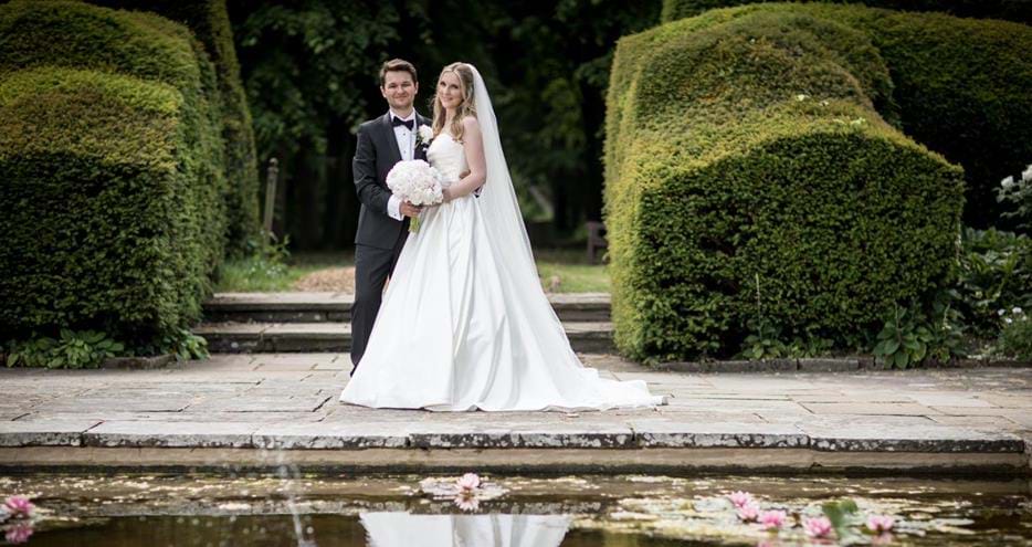 Happy couple at Port Lympne Hotel country wedding venue in Kent, UK. By Jeff Oliver Photography