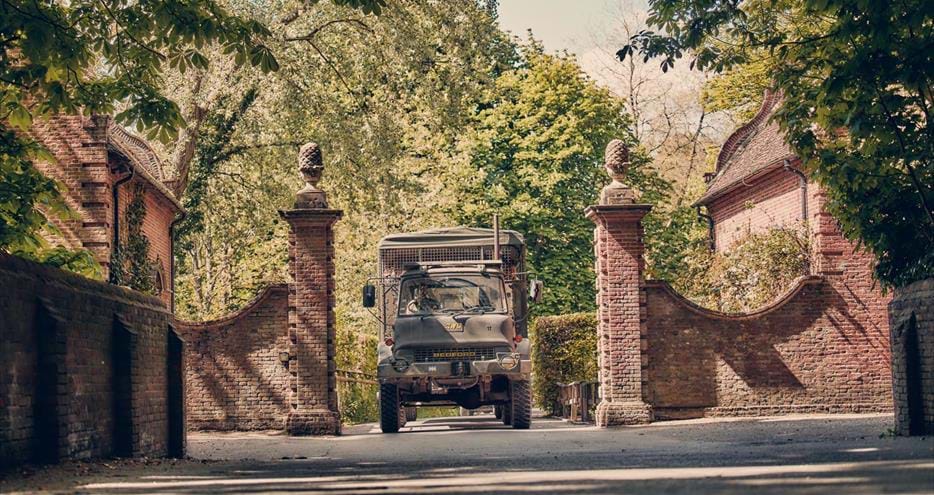 Truck safari sets off through the historic gates at Port Lympne Hotel & Reserve in Kent