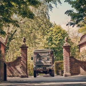 Truck safari sets off through the historic gates at Port Lympne Hotel & Reserve in Kent