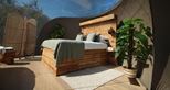 King sized bed at the Lookout Bubble glamping accommodation at Port Lympne Reserve in Kent