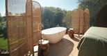 Freestanding bath tub in the Lookout Bubble glamping accommodation at Port Lympne Reserve in Kent