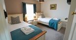 Kids twin room at Giraffe Cottage safari getaway at Port Lympne Hotel & Reserve in Kent