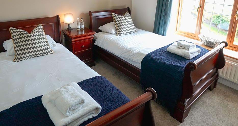 Twin room at Giraffe Cottage safari getaway at Port Lympne Hotel & Reserve in Kent