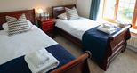 Twin room at Giraffe Cottage safari getaway at Port Lympne Hotel & Reserve in Kent