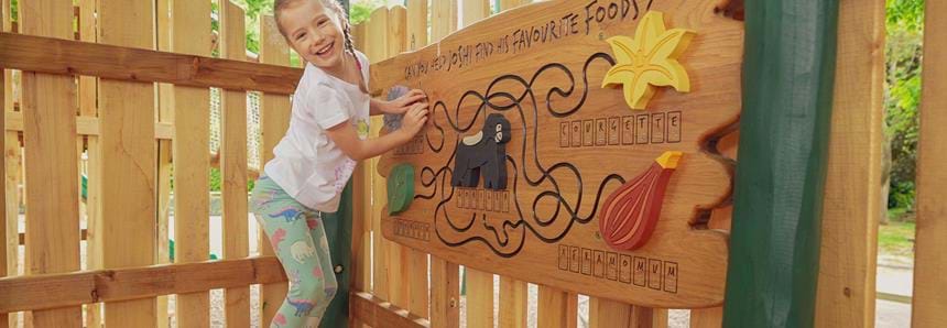 Solving the finger maze at Joshi's Jungle playground at Howletts Wild Animal Park in Kent