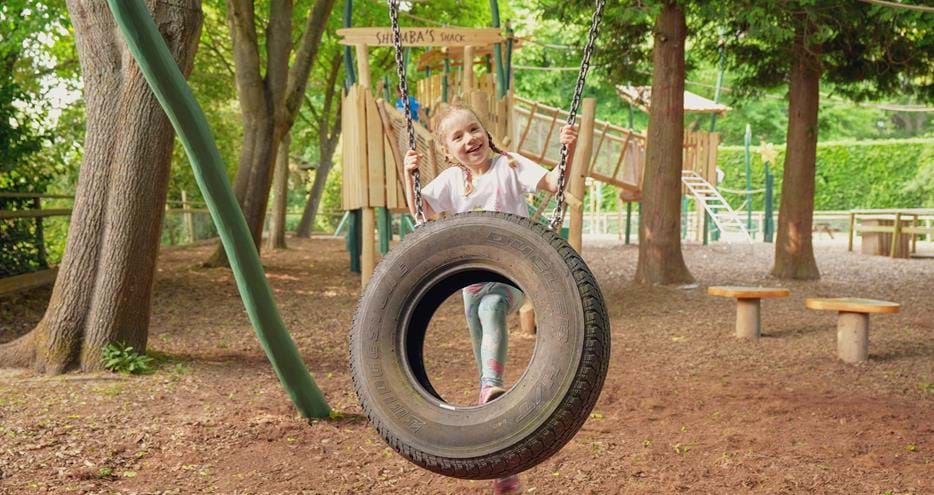 Tyre swing at Joshi's Jungle playground at Howletts Wild Animal Park in Kent